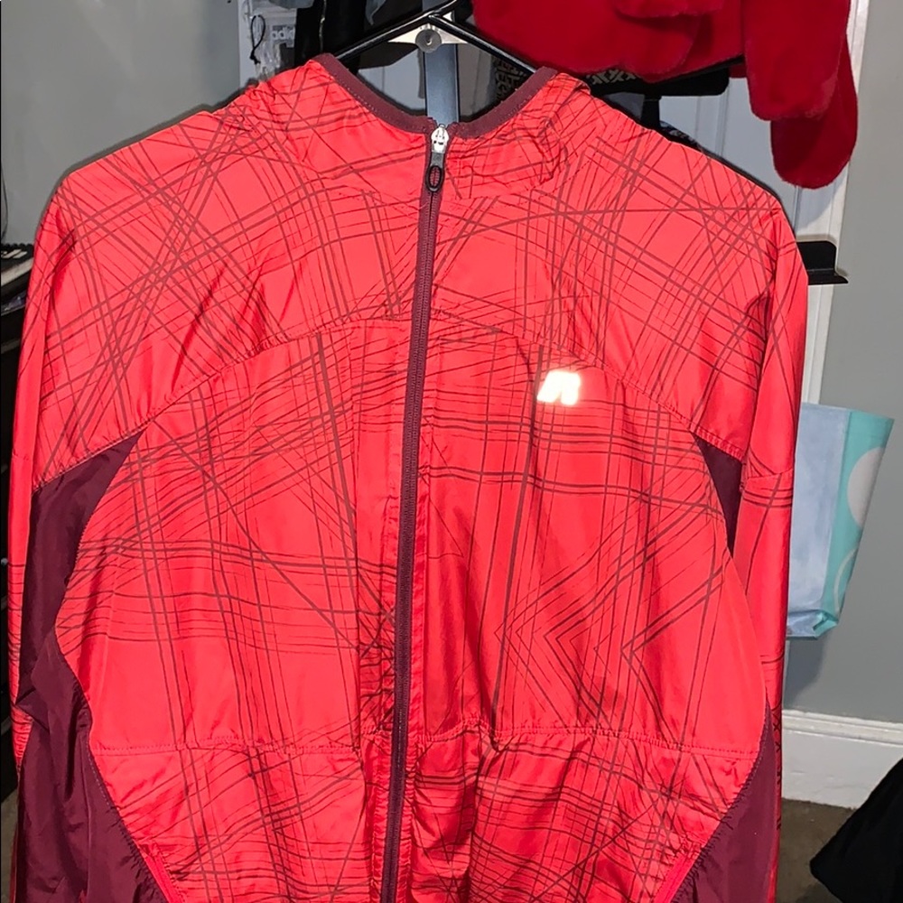 A red Zip up Windbreaker